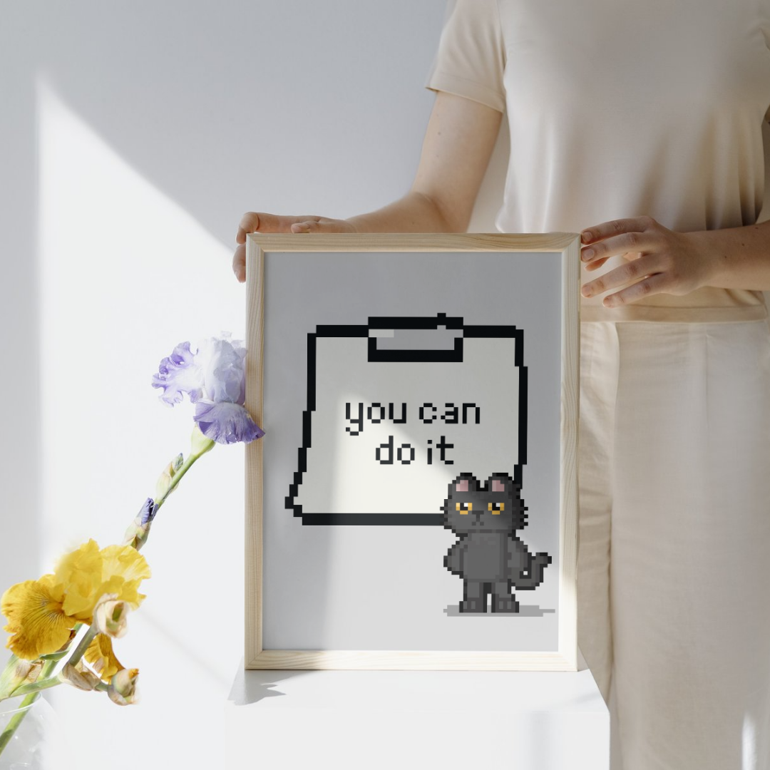 Pixel art kedi figürü ve "You Can Do It" yazılı not kağıdı illüstrasyonu sanatsal baskı detay çekimi